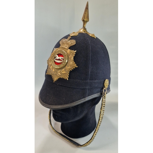 177 - British Victorian blue cloth helmet, with West Yorkshire Regiment brass helmet plate and chin strap.... 