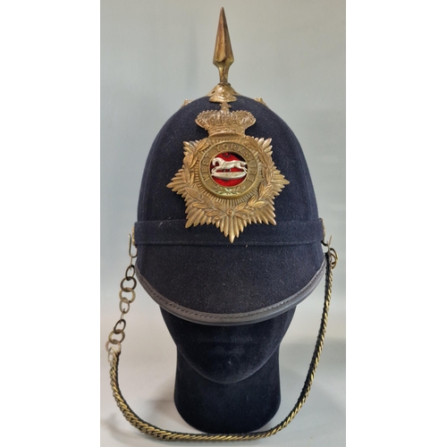 177 - British Victorian blue cloth helmet, with West Yorkshire Regiment brass helmet plate and chin strap.... 