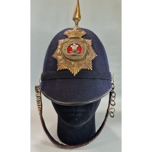 179 - British Victorian blue cloth helmet, with Welsh Regiment brass helmet plate and chin strap.  
Condit... 