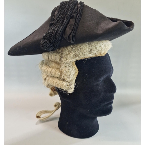 181 - Barrister wig in original tin box, together with black tricorn hat.  Tin box marked 