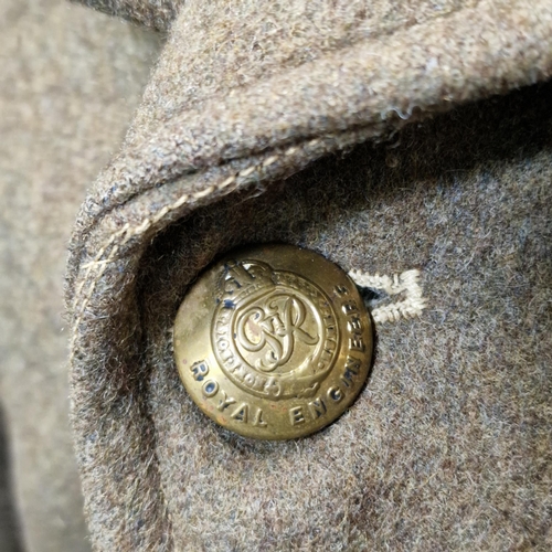 186 - British Army Great Coat, 1951 pattern, dated 1952, Size 5, with George VI Royal Engineers buttons.
C... 