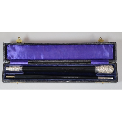 19 - George V silver embossed mounted and ebony two piece conductor's baton in original lined silk and ve... 