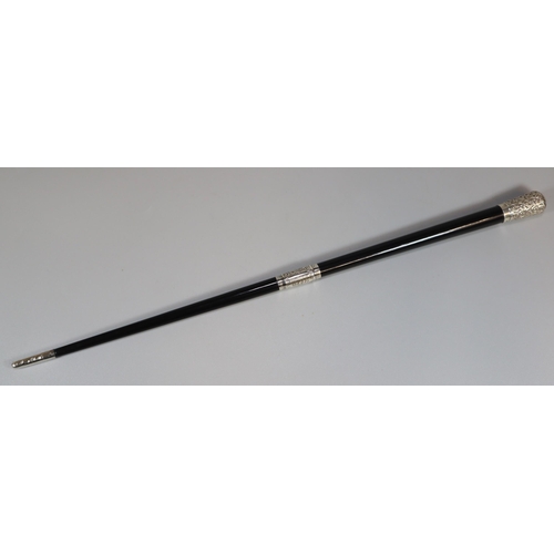 19 - George V silver embossed mounted and ebony two piece conductor's baton in original lined silk and ve... 