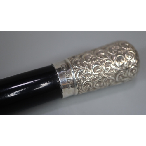 19 - George V silver embossed mounted and ebony two piece conductor's baton in original lined silk and ve... 