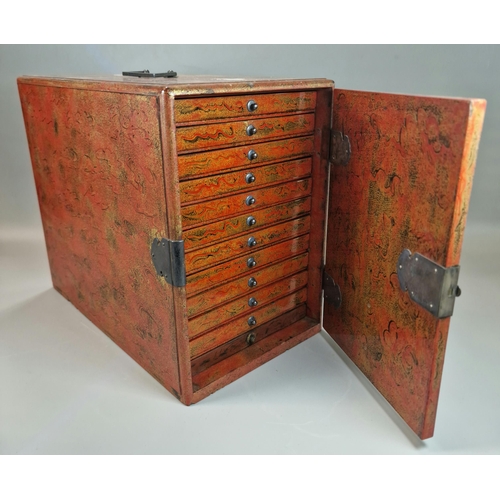 196 - Japanese Meiji Period lacquered specimen box/coin cabinet, the hinged door revealing twelve drawers ... 