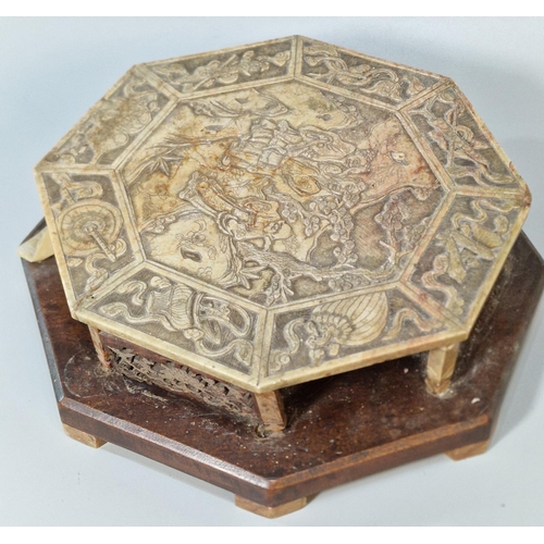 197 - Chinese carved and reticulated soap stone (steatite) stand, of octagonal form on a wooden base, the ... 