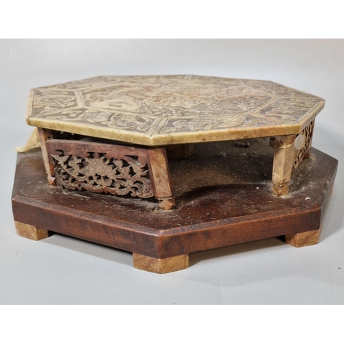 197 - Chinese carved and reticulated soap stone (steatite) stand, of octagonal form on a wooden base, the ... 