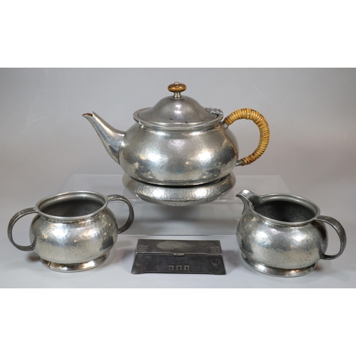 20 - Four piece Tudric beaten pewter teaset comprising baluster teapot on stand, two handled sucrier and ... 