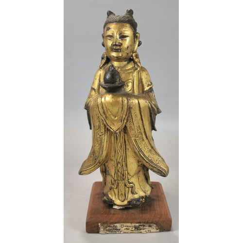 200 - Chinese Ming standing gilt bronze figure of Longnu, holding a sacrificial bowl containing a flaming ... 