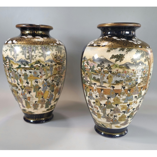 201 - Pair of Japanese Satsuma baluster vases with polychrome panels of standing and seated Geisha beneath... 