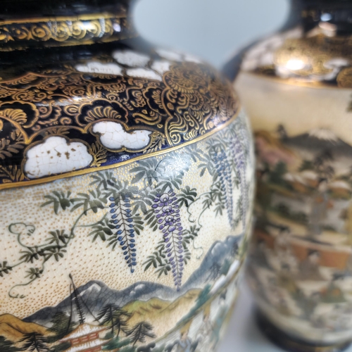 201 - Pair of Japanese Satsuma baluster vases with polychrome panels of standing and seated Geisha beneath... 