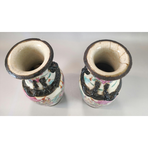 202 - Pair of Chinese porcelain crackle glaze Warrior vases with polychrome panels of horse-men and foot s... 