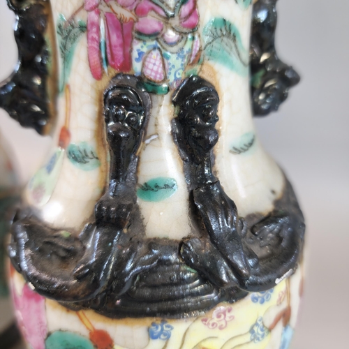 202 - Pair of Chinese porcelain crackle glaze Warrior vases with polychrome panels of horse-men and foot s... 