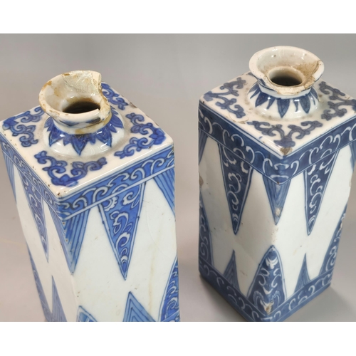 205 - Near pair of Oriental porcelain blue and white square section bottles, possibly Japanese Tokkuri Sak... 