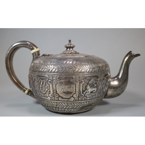 21 - Victorian silver Indianesque teapot, of cushion form, the body chased with signs of the zodiac. By G... 