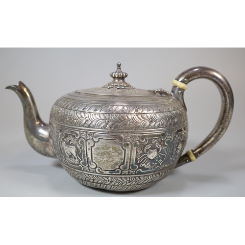 21 - Victorian silver Indianesque teapot, of cushion form, the body chased with signs of the zodiac. By G... 