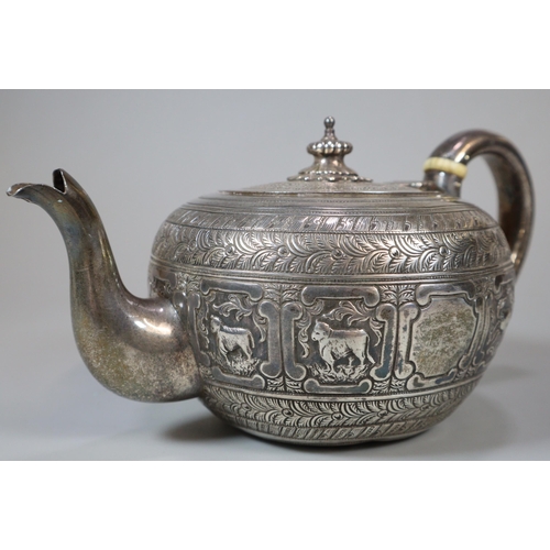 21 - Victorian silver Indianesque teapot, of cushion form, the body chased with signs of the zodiac. By G... 