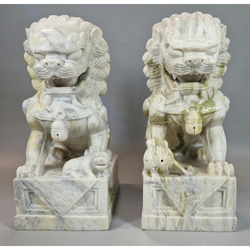 213 - Pair of Chinese carved soft stone Buddhist Temple Lions (Dogs of Foo), the male with his foot on a b... 