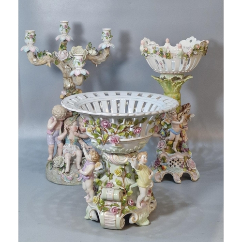 225 - Three German, including Sitzendorf, centre pieces to include two similar figural comports, the baske... 