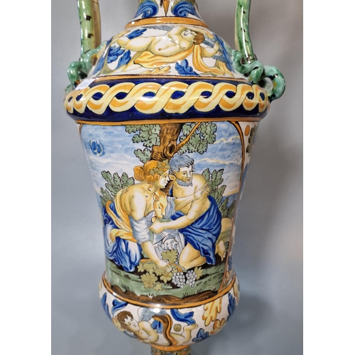 227 - Two similar Italian Majolica twin handled vases of classical form depicting classical and mythical f... 