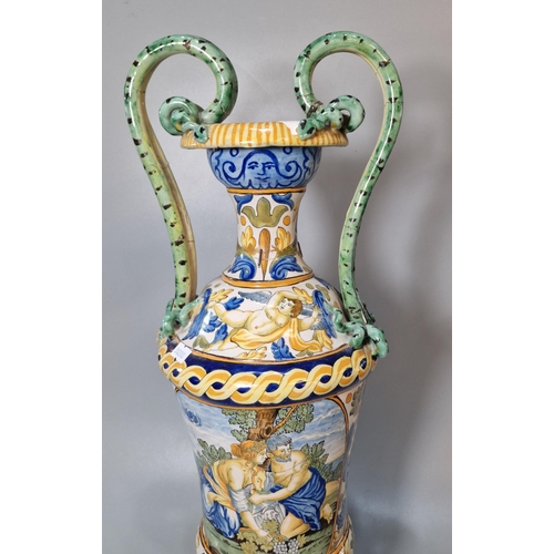 227 - Two similar Italian Majolica twin handled vases of classical form depicting classical and mythical f... 