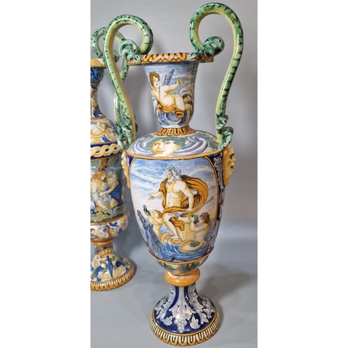 227 - Two similar Italian Majolica twin handled vases of classical form depicting classical and mythical f... 