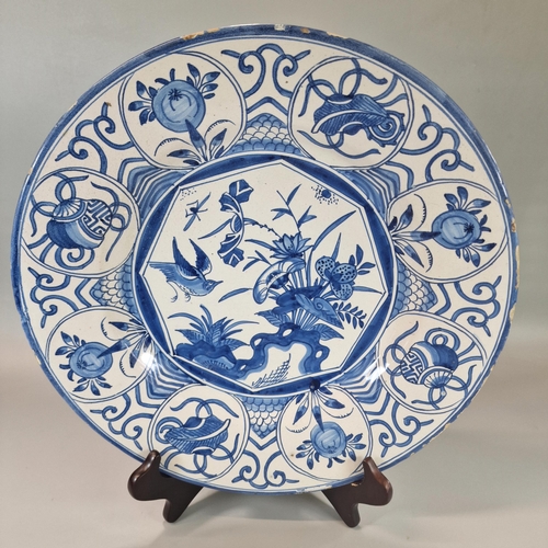 228 - 19th century Delft blue and white hand decorated tin glazed dish, overall decorated with birds among... 