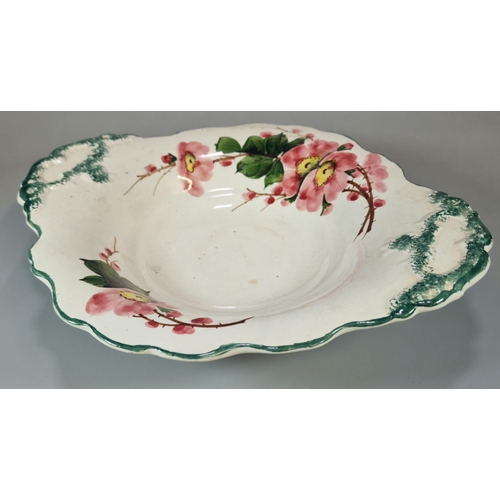 230 - Llanelly Pottery, Shufflebotham decorated elliptical bowl painted with wild roses and sponged decora... 