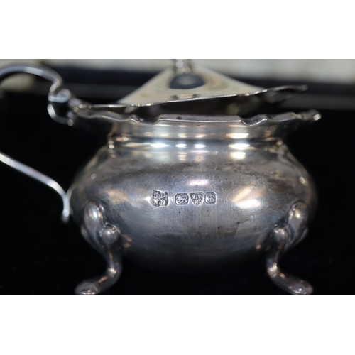 25 - George V silver five piece condiment set in original box to include: pair of boat shaped salts, must... 