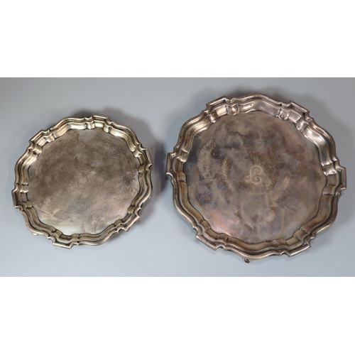 26 - Two George V silver piecrust salvers, both standing on three hoof feet, by Mappin & Webb Ltd, Sheffi... 