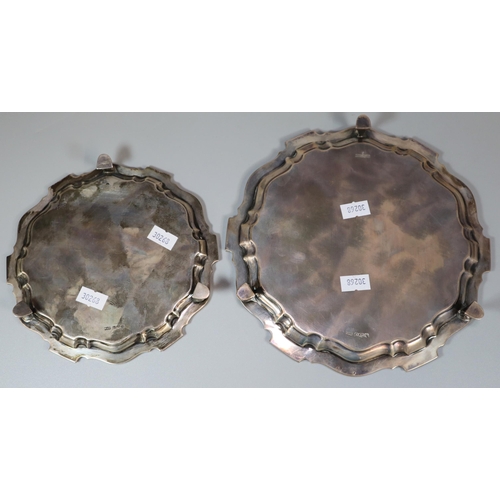 26 - Two George V silver piecrust salvers, both standing on three hoof feet, by Mappin & Webb Ltd, Sheffi... 