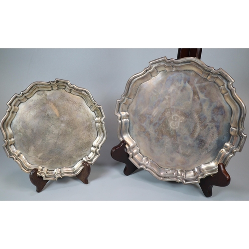 26 - Two George V silver piecrust salvers, both standing on three hoof feet, by Mappin & Webb Ltd, Sheffi... 