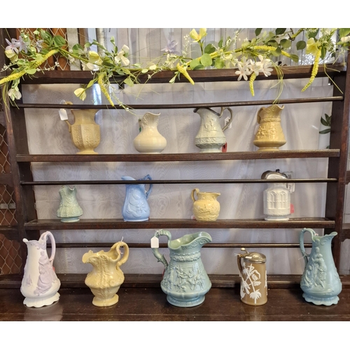 272 - Collection of 19th century pottery jugs and water jugs with pewter lids, all with moulded decoration... 