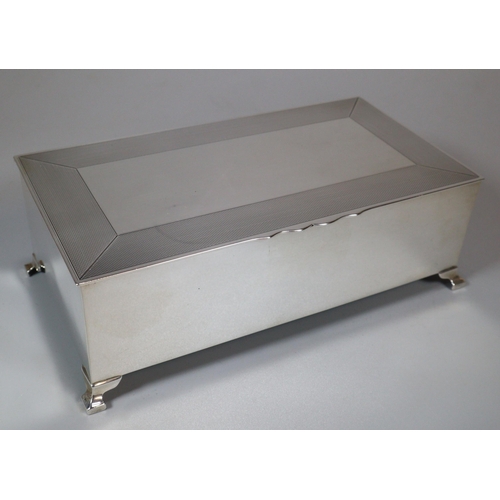 32 - George V silver cigar box, of rectangular form, possibly Mappin & Webb, the hinged lid with engine t... 