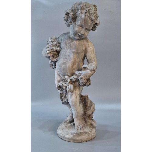 326 - Antiqued and weathered lead garden sculpture of a nude cherub with flowers on a naturalistic base. 7... 