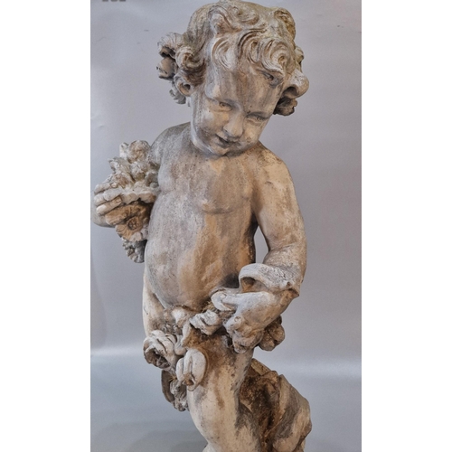 326 - Antiqued and weathered lead garden sculpture of a nude cherub with flowers on a naturalistic base. 7... 