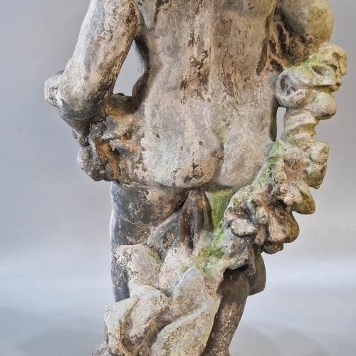 326 - Antiqued and weathered lead garden sculpture of a nude cherub with flowers on a naturalistic base. 7... 