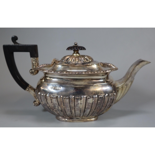 38 - George V silver fluted teapot with ebonised handle and fluted finial, by Pinder Brothers, Sheffield ... 