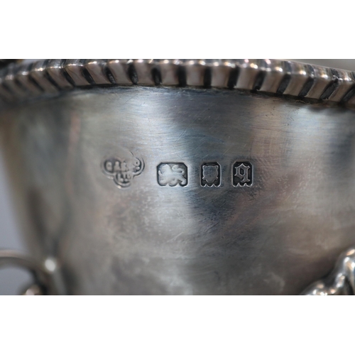 39 - Pair of George V silver gadroon edged sauce boats raised on moulded cabriole legs and paw feet, by T... 