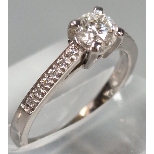 44 - 18ct white gold diamond solitaire ring, each shoulder inset with six tiny diamonds, the central ston... 