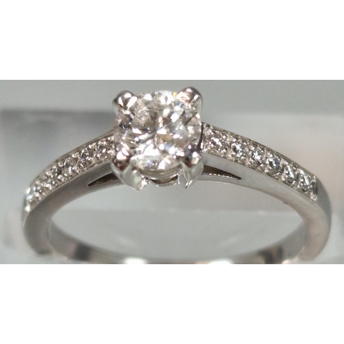 44 - 18ct white gold diamond solitaire ring, each shoulder inset with six tiny diamonds, the central ston... 