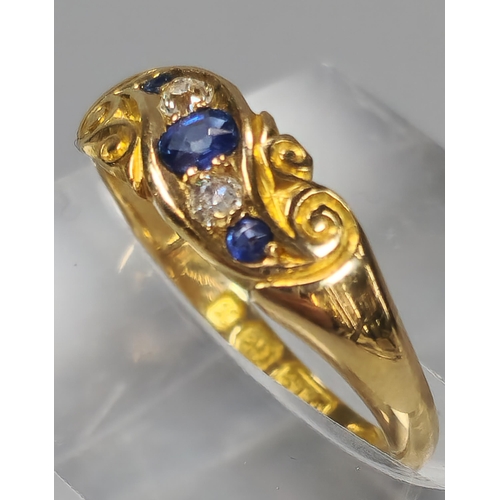 50 - Edwardian 18ct gold diamond and sapphire five stone ring of scroll form. Birmingham hallmarks. 2.6g ... 