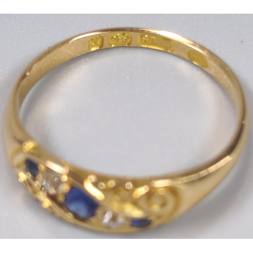 50 - Edwardian 18ct gold diamond and sapphire five stone ring of scroll form. Birmingham hallmarks. 2.6g ... 