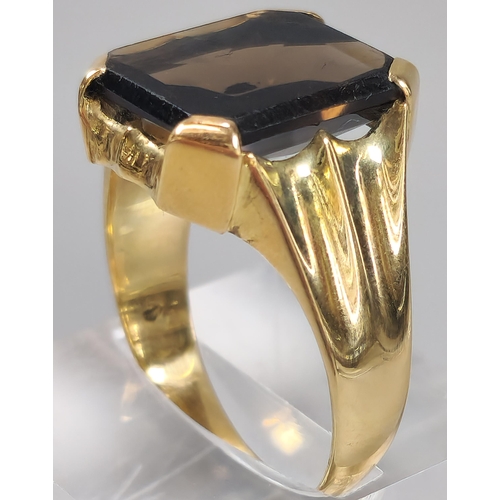 51 - 14ct gold and smokey quartz signet ring. 8.6g approx. Size U. (B.P. 21% + VAT)