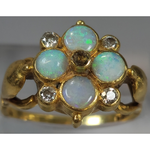 52 - 18ct gold flowerhead ring inset with four diamonds and four opals (missing one diamond). 5g approx. ... 