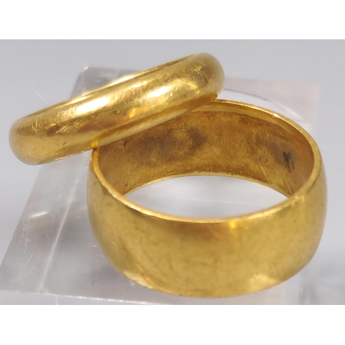 53 - Two 22ct gold wedding bands. Total weight 16.6g approx. Sizes P and L. (2) (B.P. 21% + VAT)