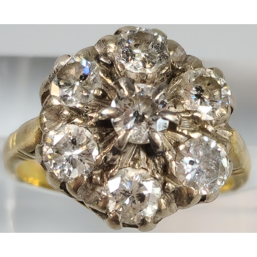 64 - 18ct gold diamond seven stone flowerhead cluster ring. 7.5g approx. Size O. (B.P. 21% + VAT)