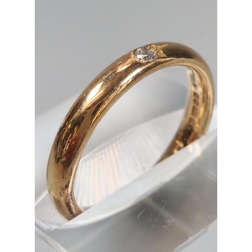 69 - 18ct Clogau Gold wedding band inset with tiny diamond chip. 3.9g approx. Size L. (B.P. 21% + VAT)