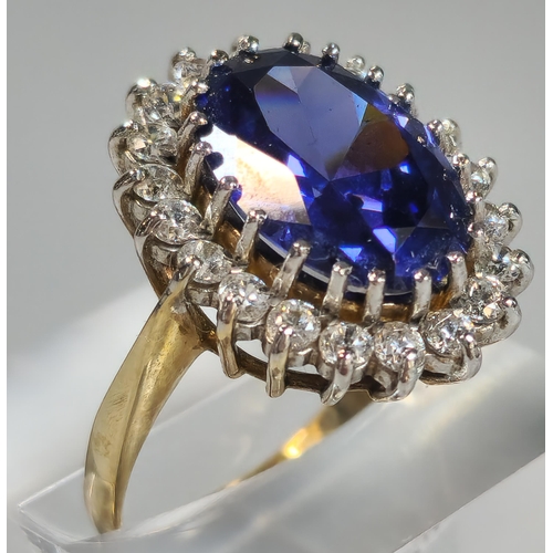 71A - 9ct gold Cubic Zirconia and blue oval stone dress ring. 5.6g approx. Size O1/2. (B.P. 21% + VAT)