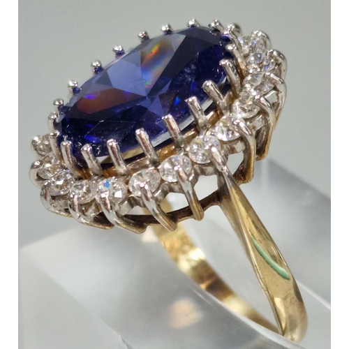 71A - 9ct gold Cubic Zirconia and blue oval stone dress ring. 5.6g approx. Size O1/2. (B.P. 21% + VAT)